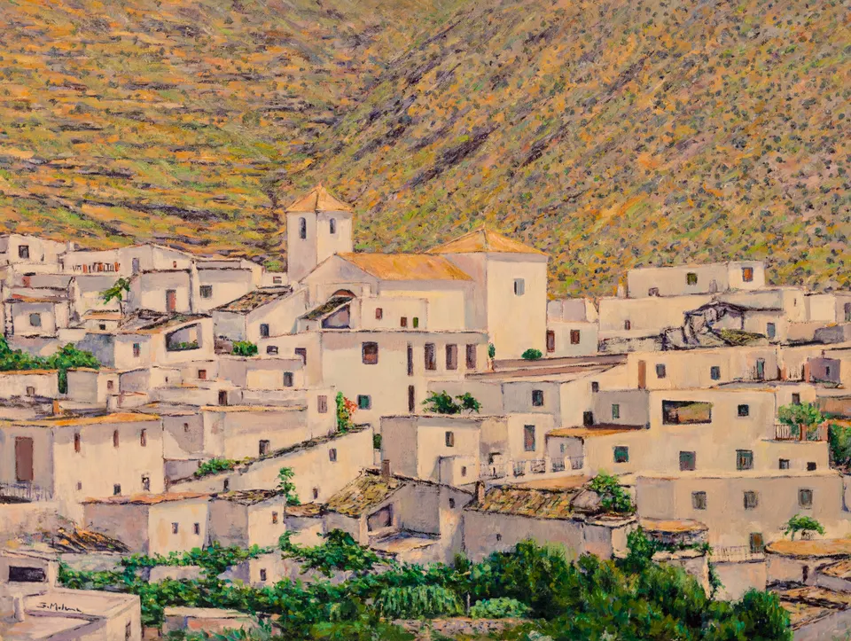 White village below the mountain