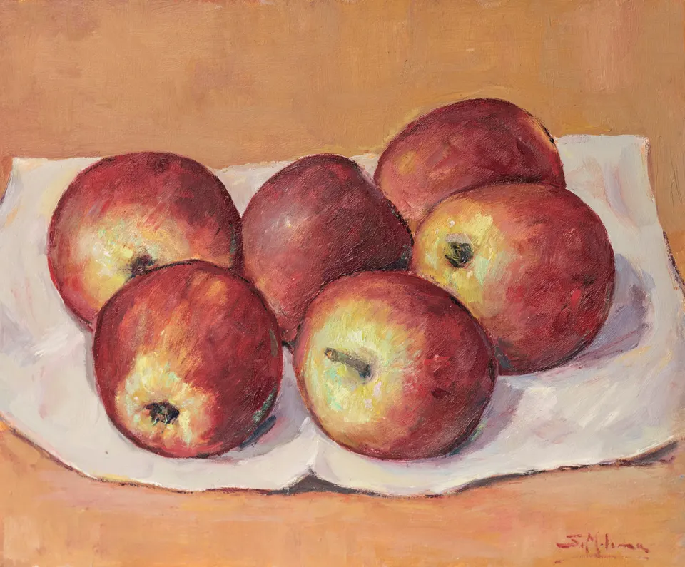 Red apples on white cloth