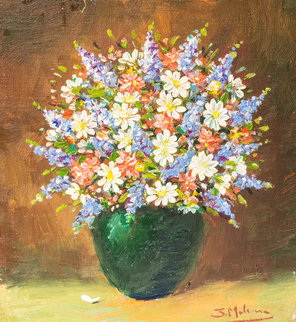 Daisies in a green vase