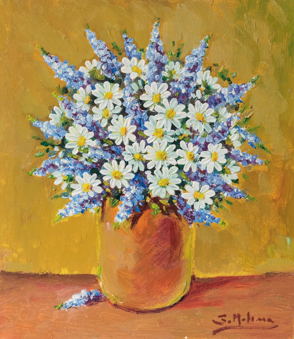 Daisies against a yellow wall