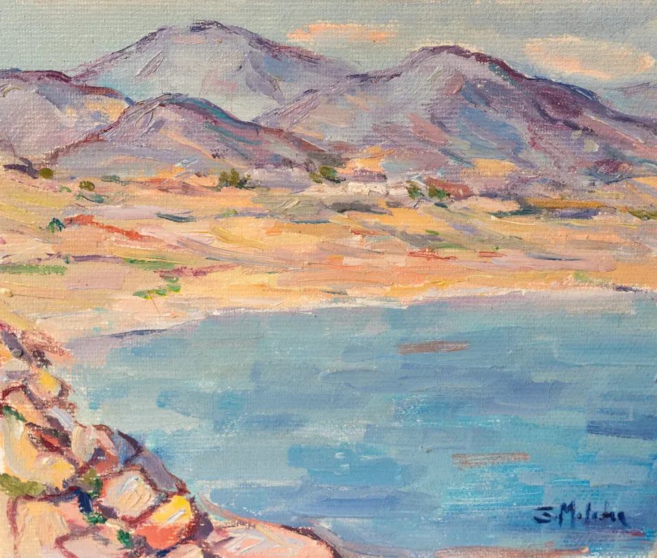 Bay below mauve mountains